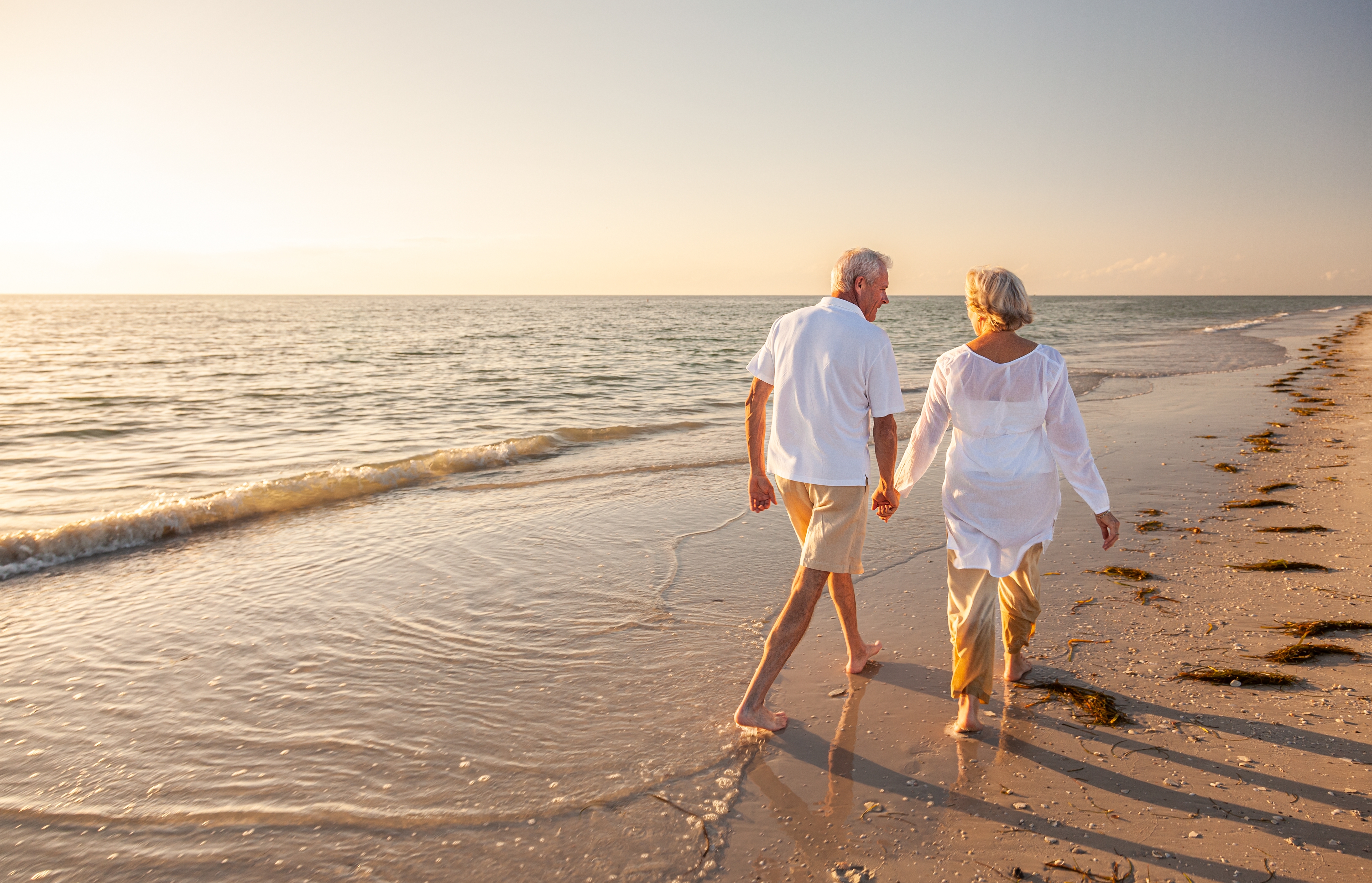 Couple On Beach Holding Hands Generic