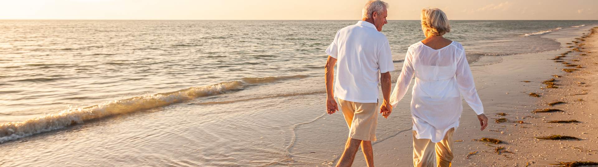 Couple On Beach Holding Hands Generic