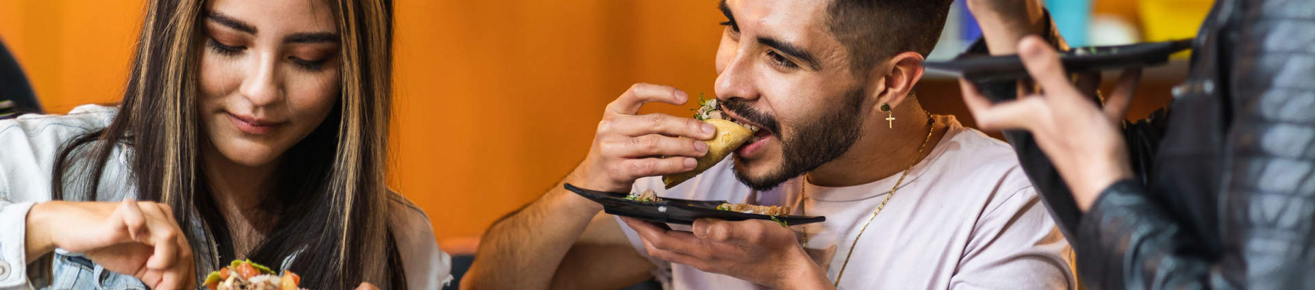 Group Of Friends Eating Tacos