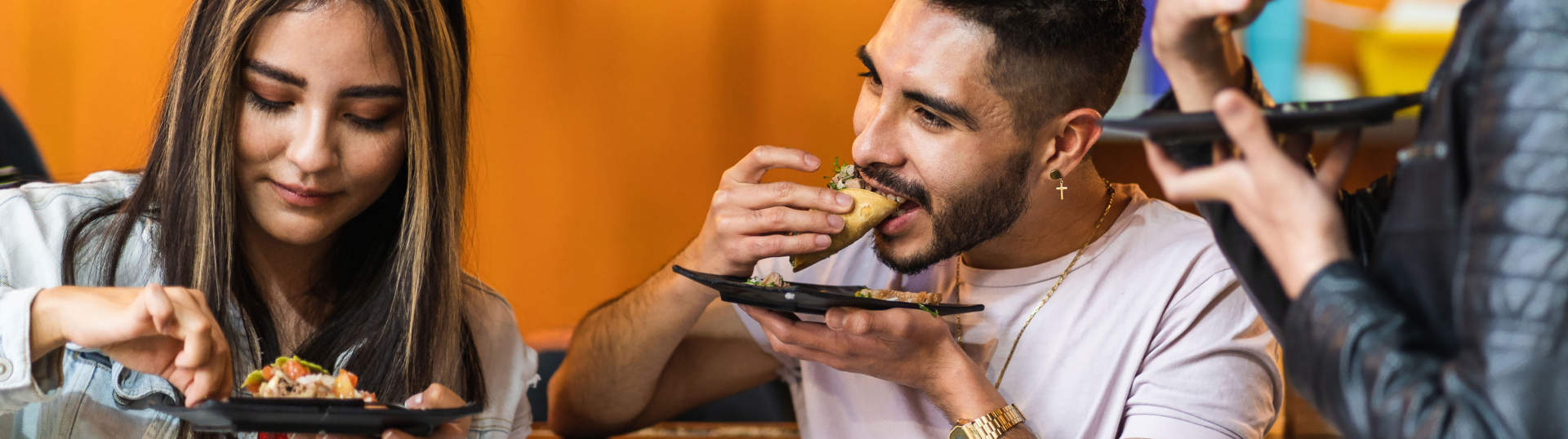 Group Of Friends Eating Tacos