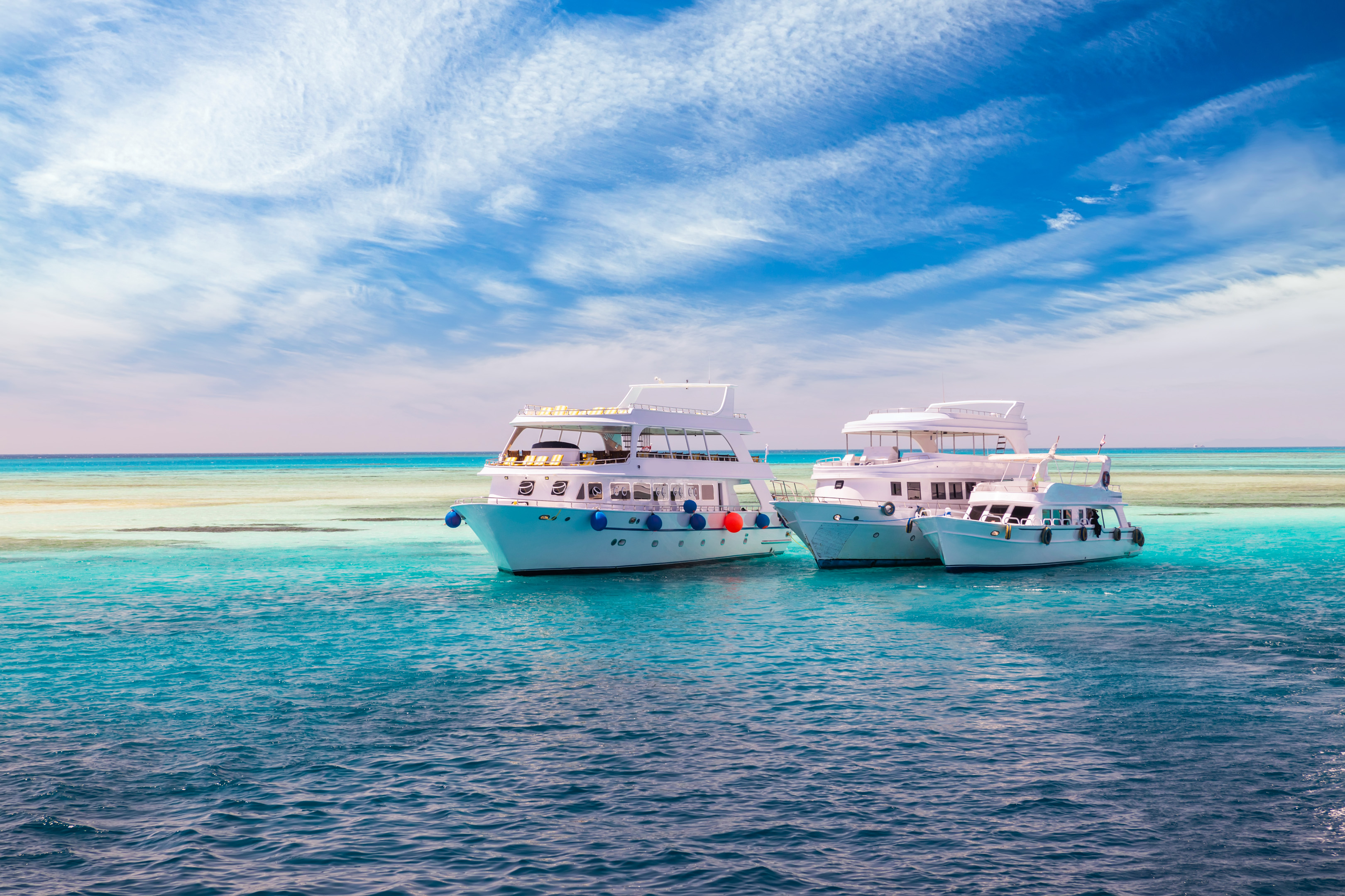 Cruise Yacht Bow In Clear Water Near A Coral Reef. Red Sea, Egypt