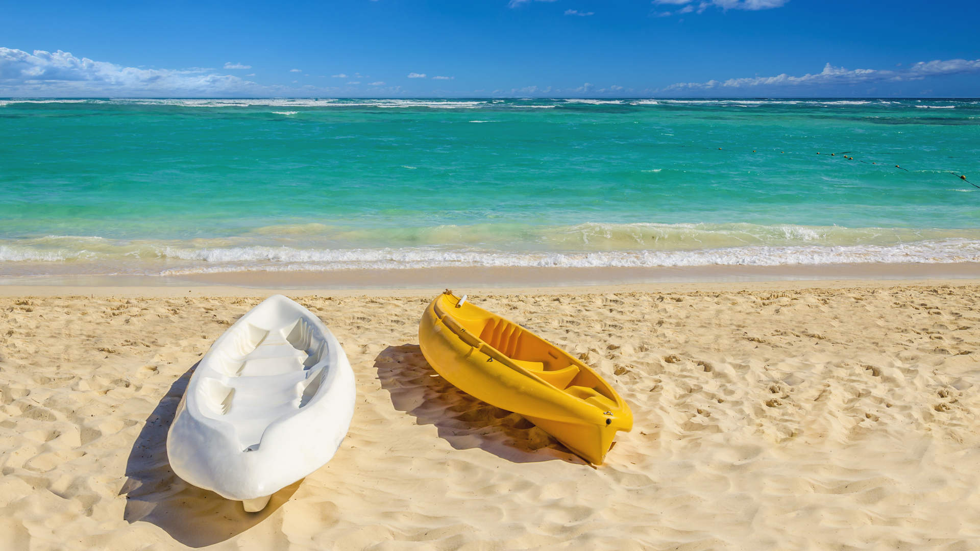 White And Yellow Kayaks On Sandy Caribbean Beach Jamaica