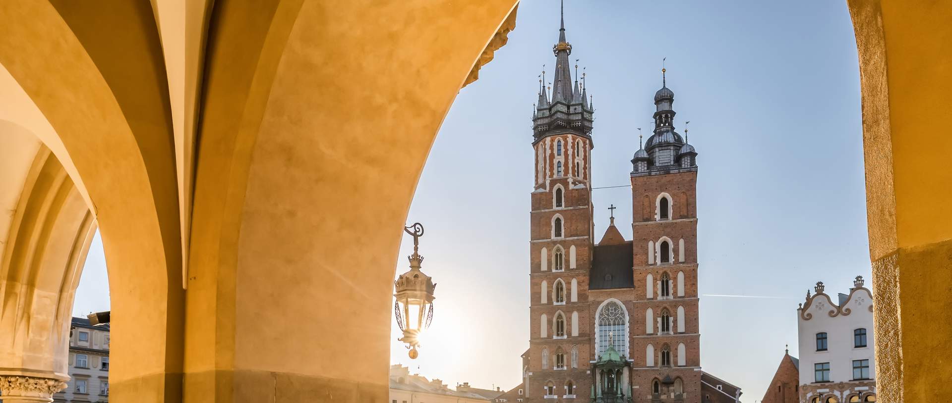 Krakow Cloth Hall And Saint Mary's Basilica On The Main Market Square At Sunrise In Cracow, Poland