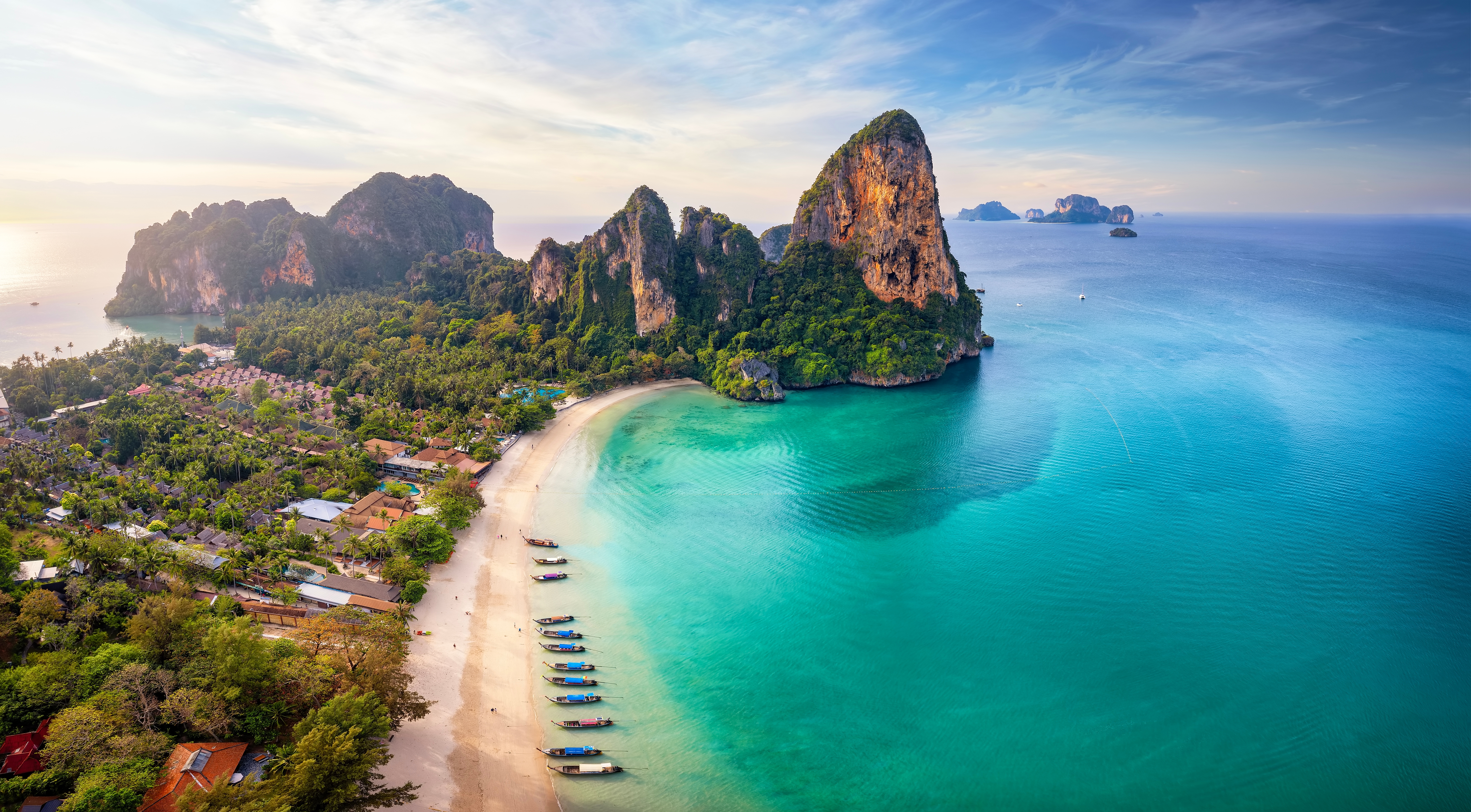 Panoramic Aerial View Of The Beautiful Railay Beach, Krabi, Thailand, Lush Rain Forest And Emerald Sea During Morning Sunrise Without People