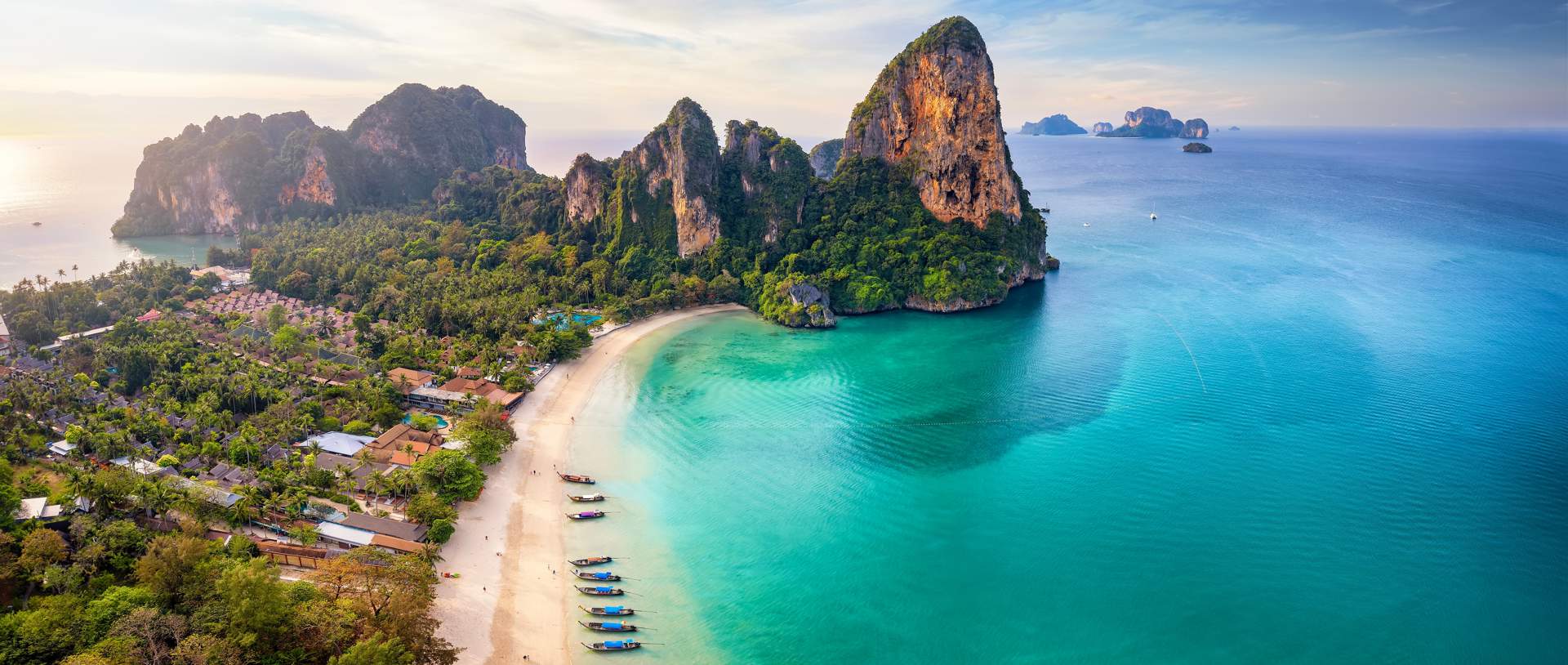 Panoramic Aerial View Of The Beautiful Railay Beach, Krabi, Thailand, Lush Rain Forest And Emerald Sea During Morning Sunrise Without People